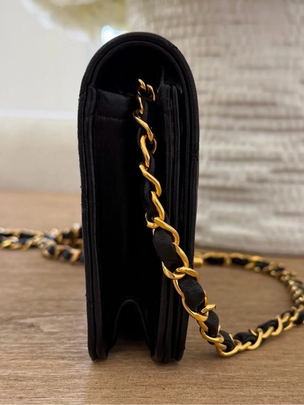 CHANEL Black Quilted Shoulder Bag with Gold Chain and CC Lock